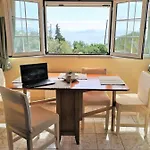 Сasa de vacaciones Achilleion Holiday Home